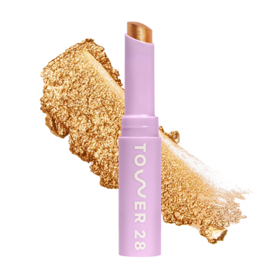 Eyeshadow with glittery texture and 'Tower 28' branding on a white background [Bungalow]