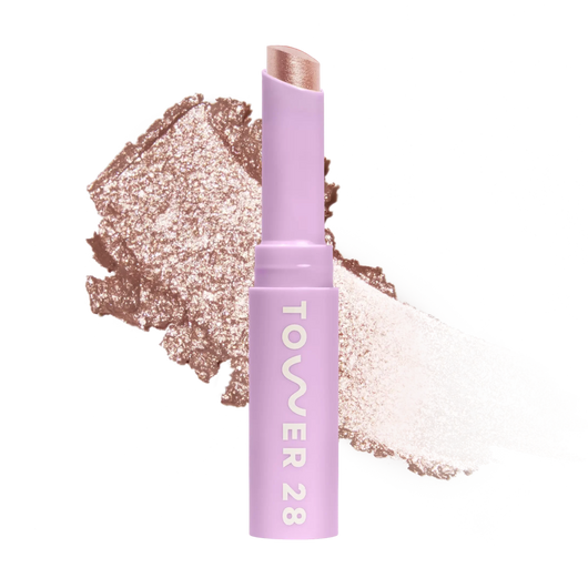 Eyeshadow with glittery texture and 'Tower 28' branding on a white background [Roxy]