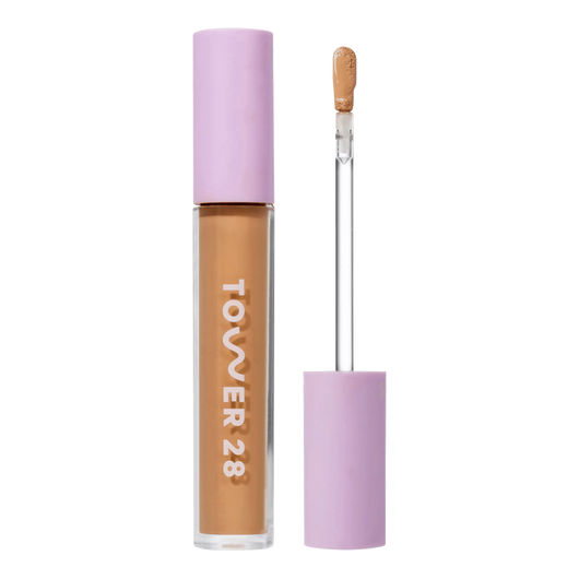 Tower 28 Beauty Swipe Serum Concealer in the shade 12.0 PALI, shown with the tube standing upright next to the open applicator wand to reveal the product. [12.0 PALI]