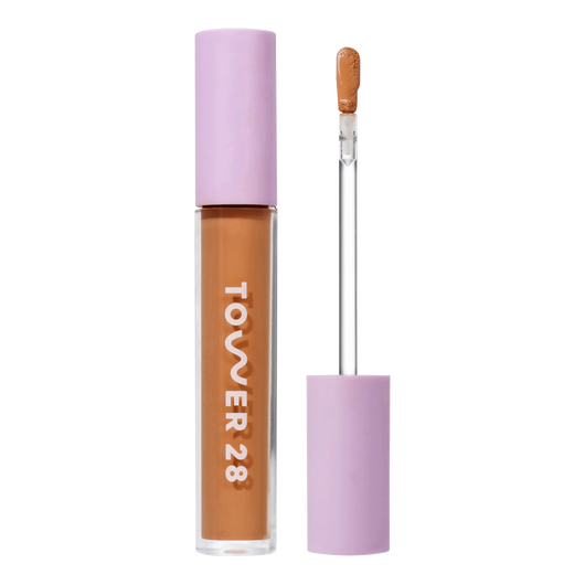 Tower 28 Beauty Swipe Serum Concealer in the shade 14.0 PV, shown with the tube standing upright next to the open applicator wand to reveal the product. [14.0 PV]