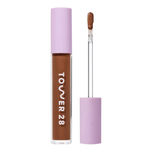 Tower 28 Beauty Swipe Serum Concealer in the shade 17.0 SD, shown with the tube standing upright next to the open applicator wand to reveal the product. [17.0 SD]