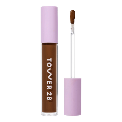 Tower 28 Beauty Swipe Serum Concealer in the shade 19.0 WEHO, shown with the tube standing upright next to the open applicator wand to reveal the product. [19.0 WEHO]