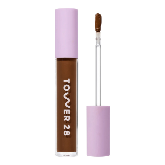 Tower 28 Beauty Swipe Serum Concealer in the shade 19.0 WEHO, shown with the tube standing upright next to the open applicator wand to reveal the product. [19.0 WEHO]